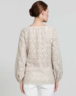 Never go wrong in a genteel lace top like this Tory Borch look. Feel 