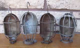 of 4 Vintage Industrial Machine Age Trouble Light Cages. 3 have hooks 