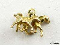 This charm is gold toned . This item is in excellent original and 