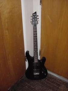 DELUXE ELECTRIC GUITAR. WORKS GREAT. MISSING A STRING. THIS GUITAR 