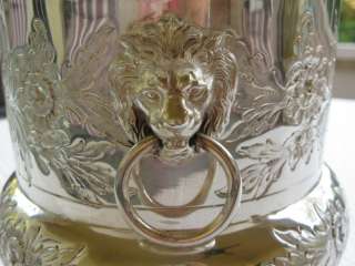  two lion heads handles, compana form wine cooler made and signed by