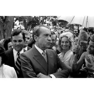  Richard Nixon standing in a crowd of people at daughter Tricia Nixon 
